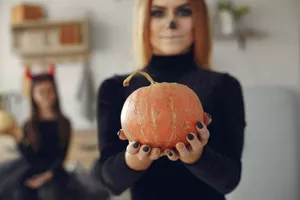 Mother with daughter in a halloween costume and makeup Mother with daughter in a halloween costume and makeup